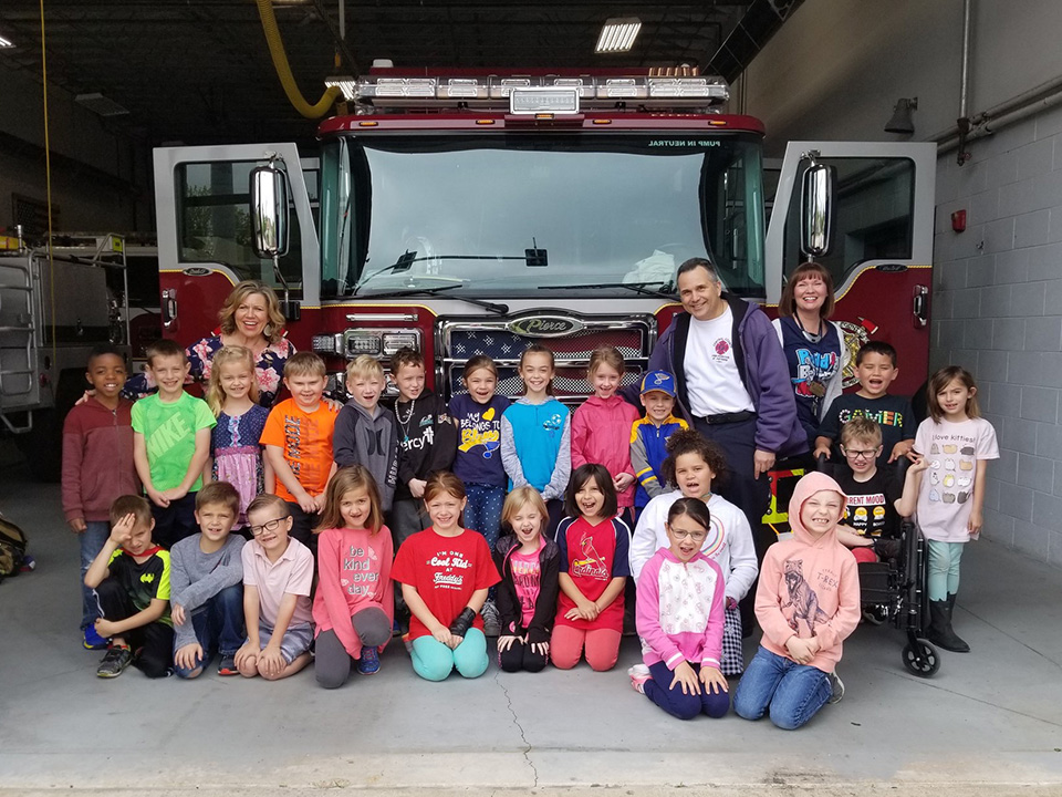 Elementary school visiting the firehouse